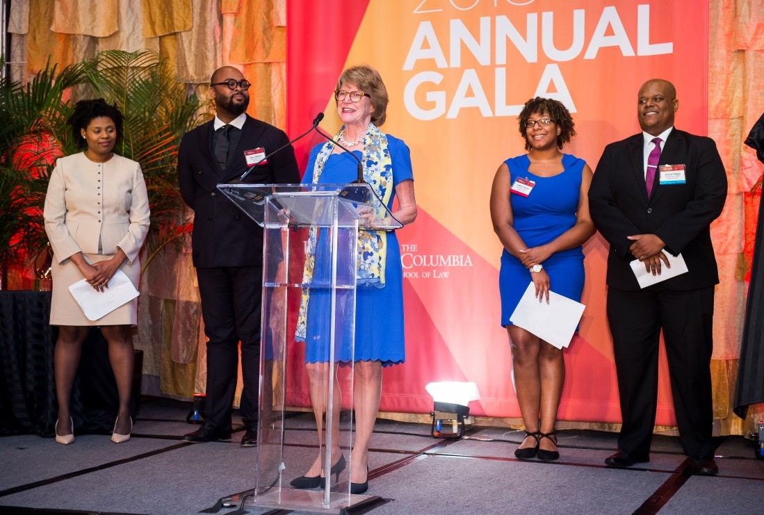 Dean Broderick and students on stage