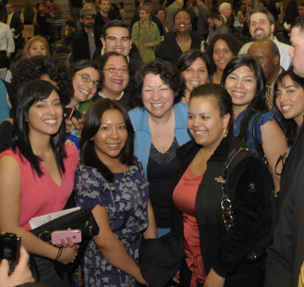 Justice Sotomayor posing with students
