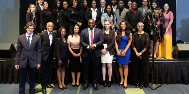 Group photo of students with Dean Hutchins and Professor Brittain